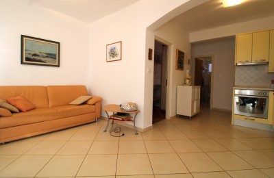 Apartment on the ground floor, two bedrooms with a landscaped yard, 900 m from the sea!!